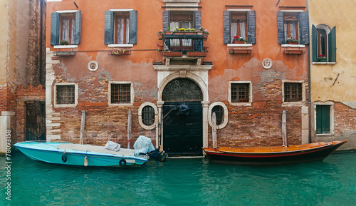 Two motor boats near entrance of the house © aragami