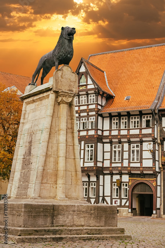 Lion statue and old timbered house in Braunschweig photo