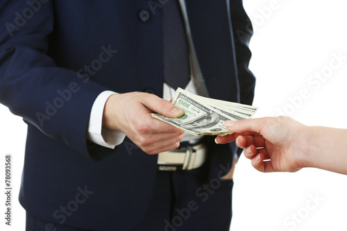 Businessman paying money isolated on white