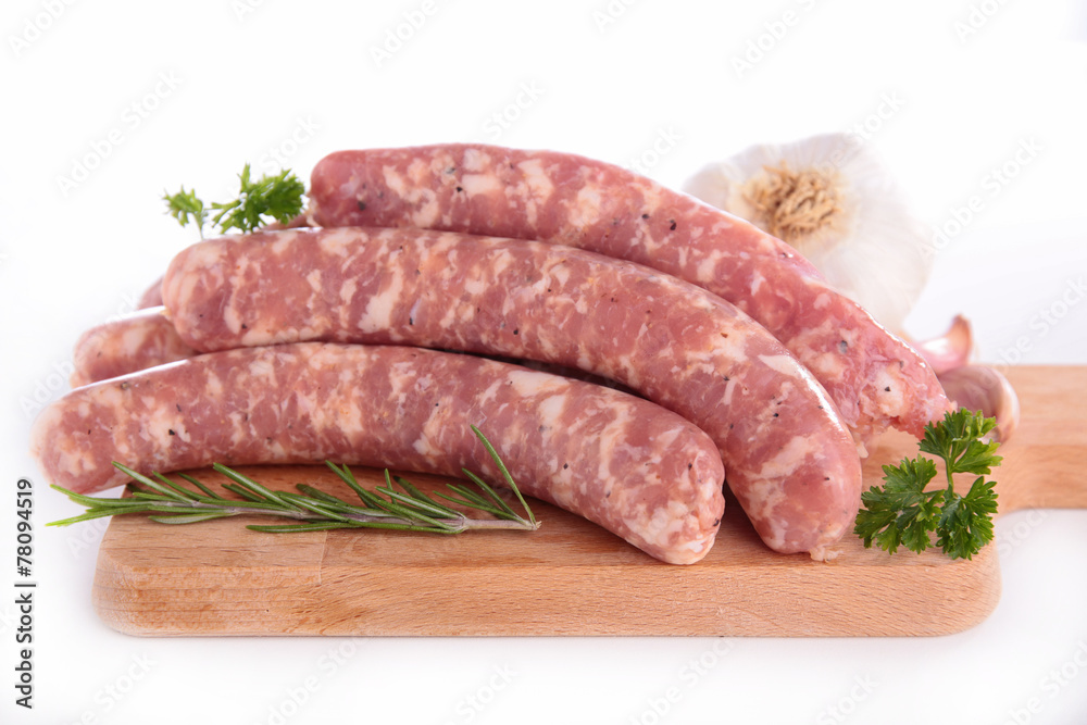 raw sausage on plank