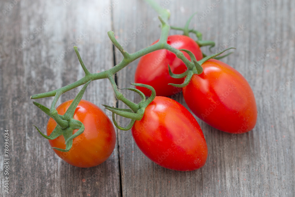 Fresh Tomatoes on old wood background Fresh Tomatoes on old wood background