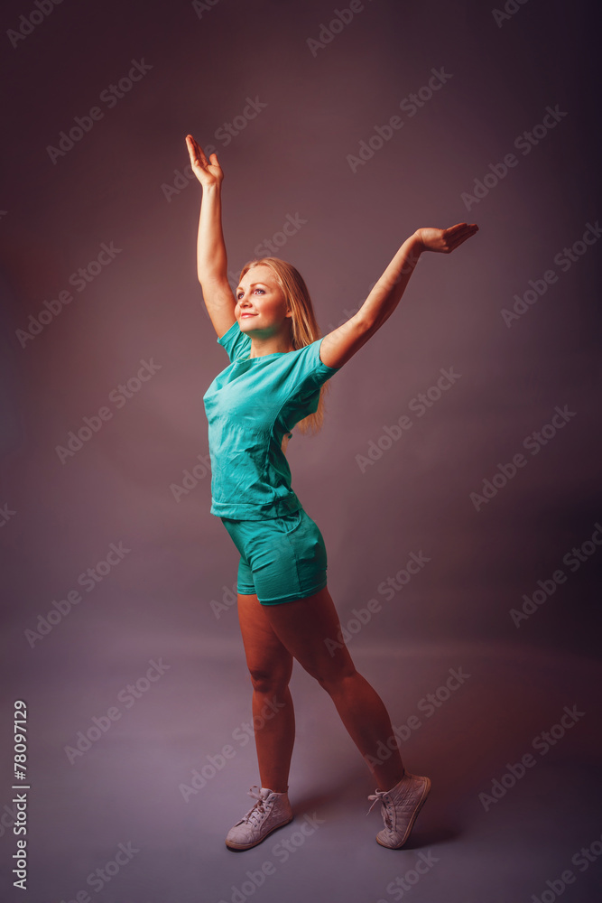 European-looking woman of thirty years raised her hands up on a European-looking woman of thirty years raised her hands up on a
