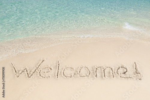 Welcome Written On Sand By Sea