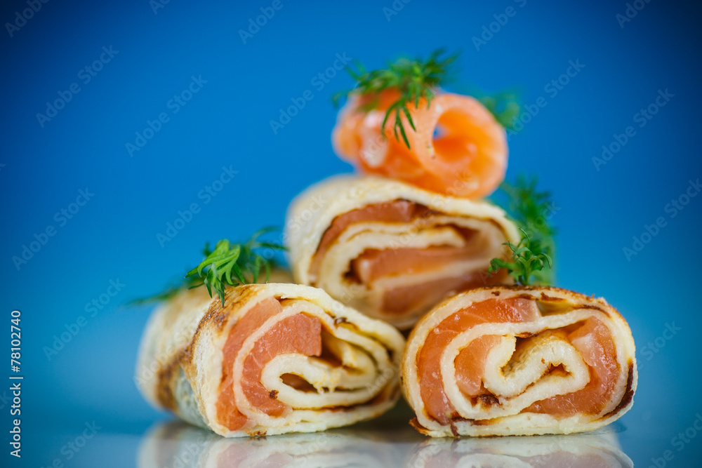 rolls of thin pancakes with salted red fish rolls of thin pancakes with salted red fish
