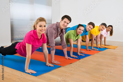 Group Of People Doing Push Ups