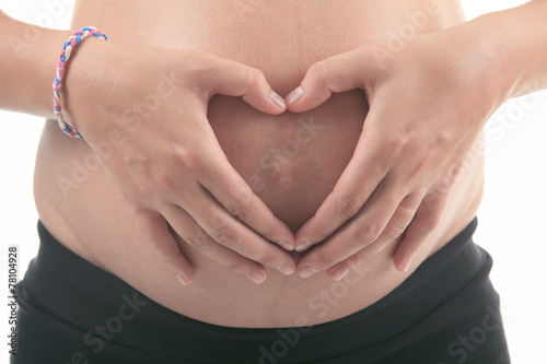 Wallpaper Mural Photo of a pregnant woman over studio white background Torontodigital.ca