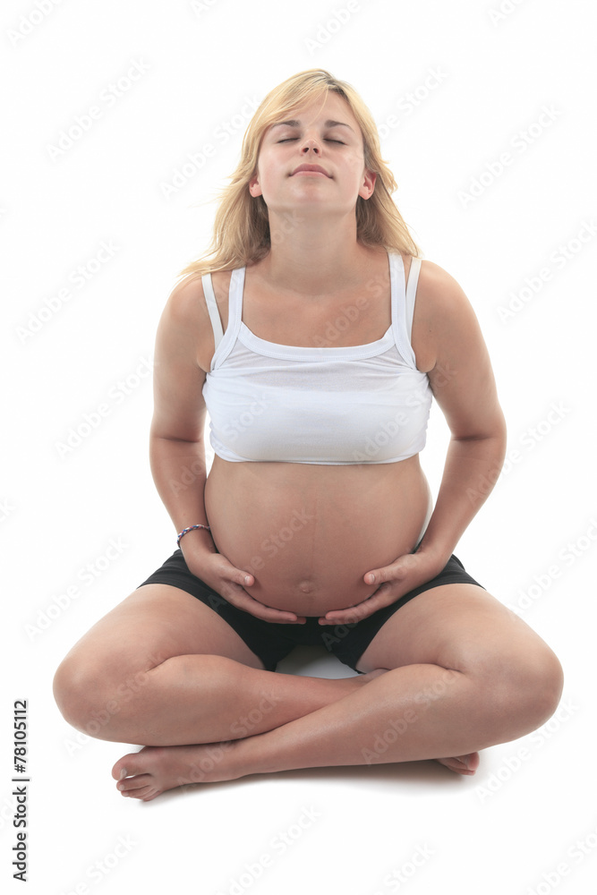 Photo of a pregnant woman over studio white background