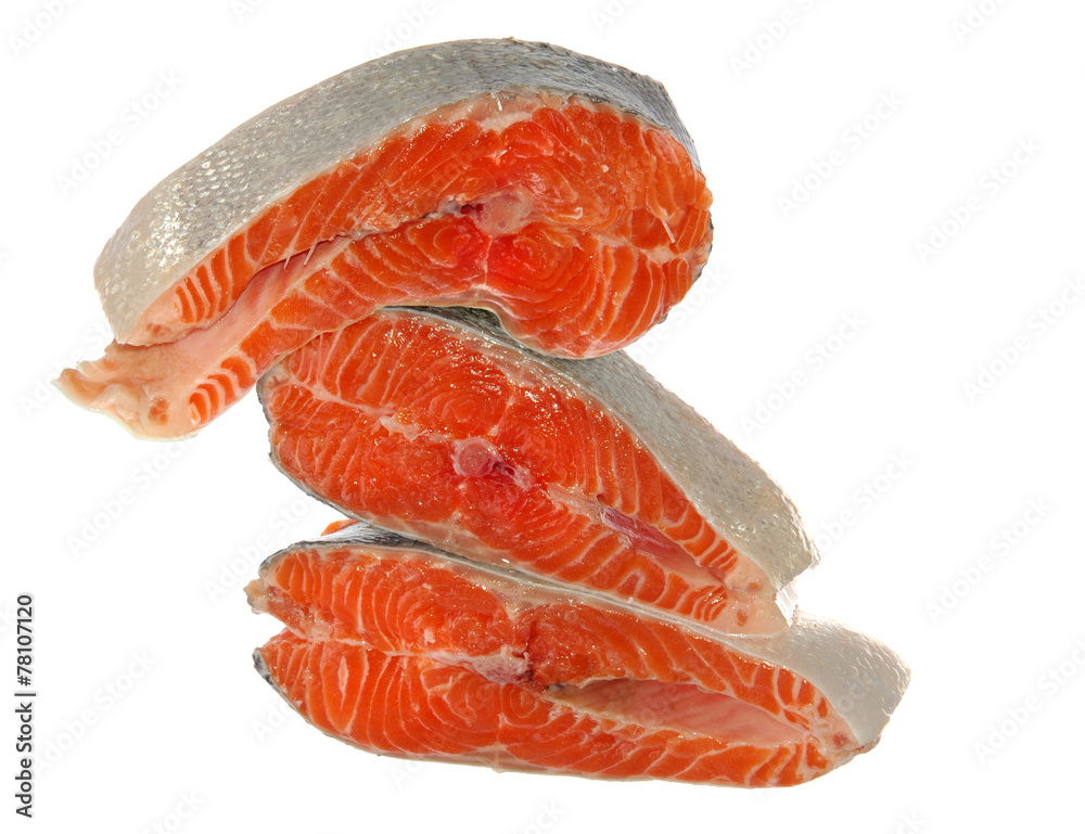heap of raw salmon pieces isolated on white