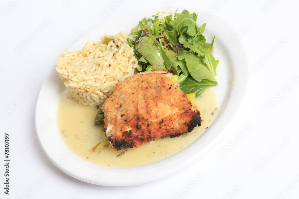 A Grilled chicken fillet, rise and salad with it. A Grilled chicken fillet, rise and salad with it.