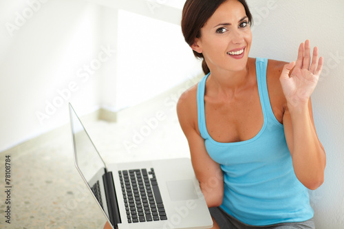 Pretty woman surfing the web on laptop