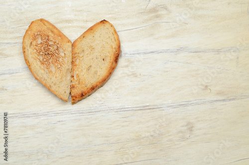Two slices of toasted bread in heart shape