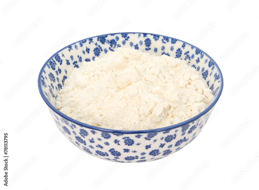 All purpose flour in a blue and white china bowl