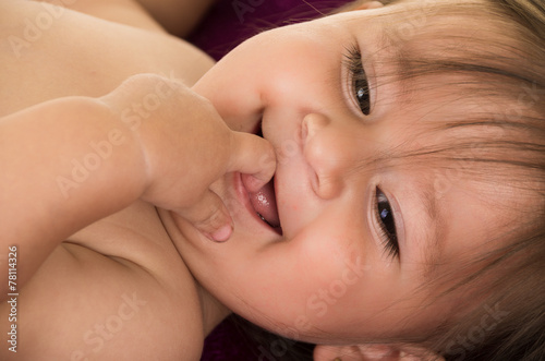 portrait of adorable brunette baby girl