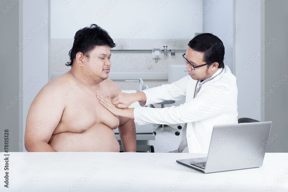Fototapeta premium Fat man check up to doctor 1