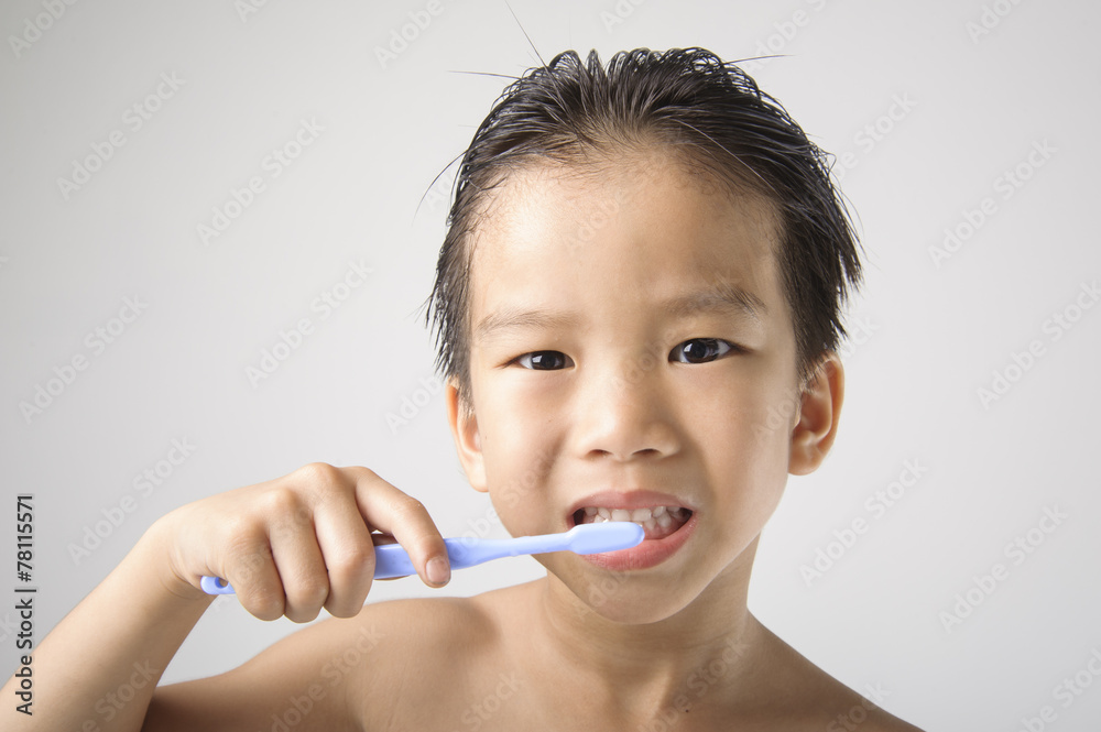 The boy brushing to clean his teeth. The boy brushing to clean his teeth.