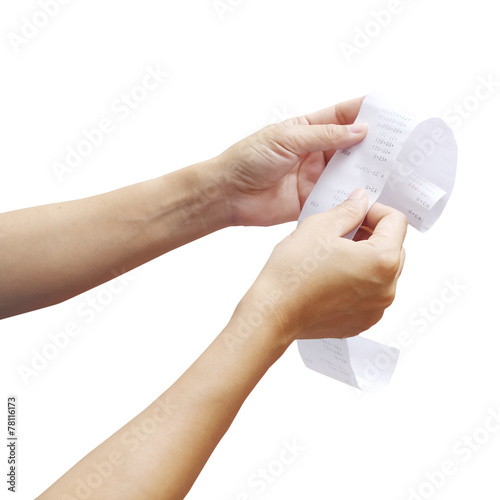 hand of woman checking a long  receipt