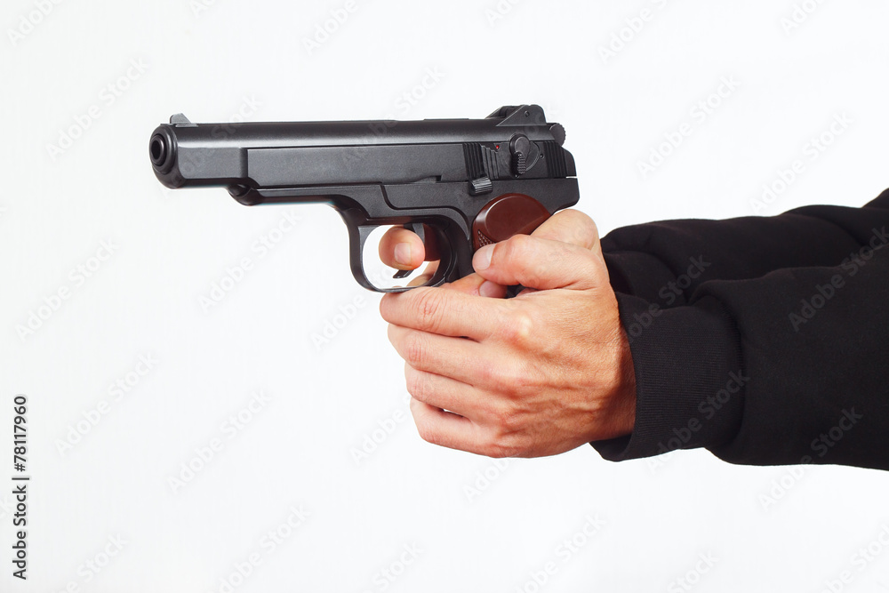 Hands with army pistol on a white background Hands with army pistol on a white background