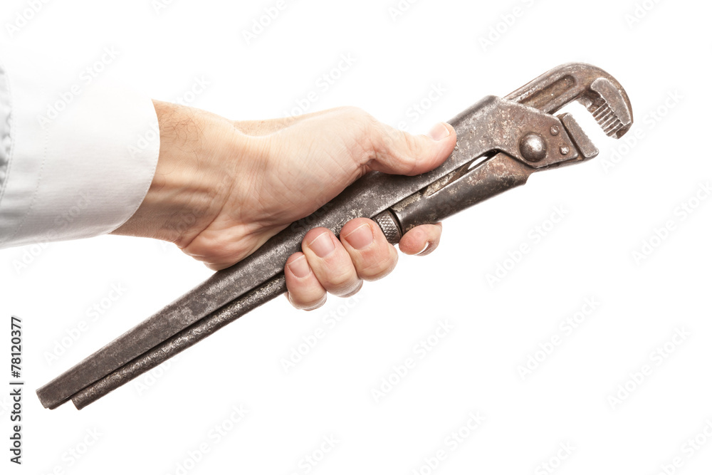 Steel screw wrench in male hand isolated on white Steel screw wrench in male hand isolated on white