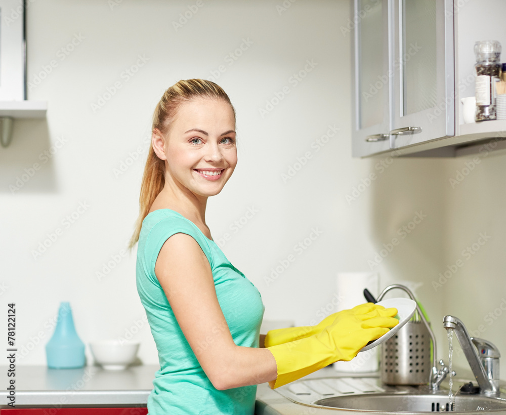 happy woman washing dishes at home kitchen happy woman washing dishes at home kitchen