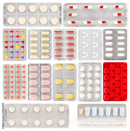 Valokuvatapetti Set of pills in a plastic blister package, on white background