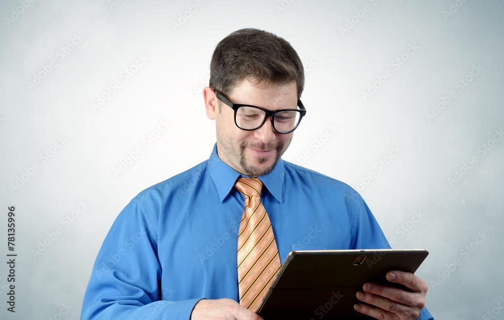 Businessman in glasses with the tablet Businessman in glasses with the tablet