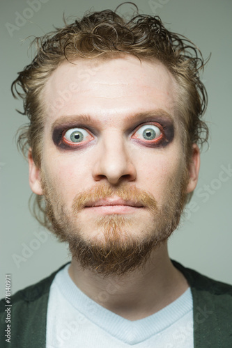 portrait of a man with bulging eyes. photo