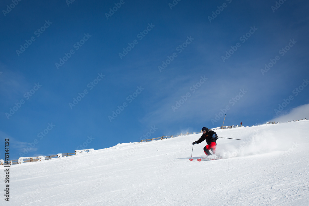 Man sliding on ski