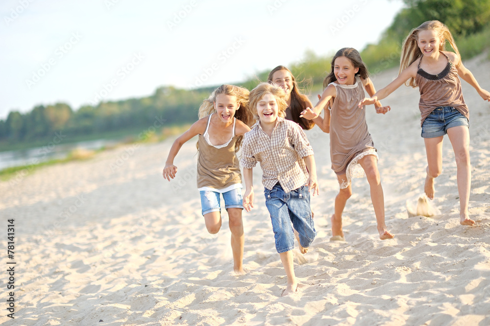 Portrait of children on the beach in summer