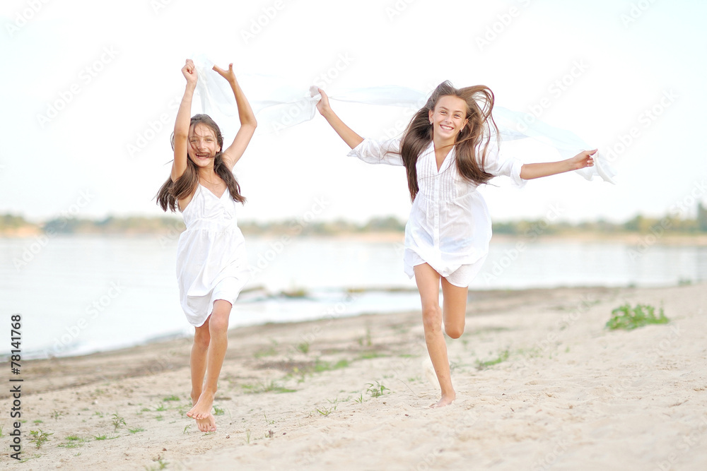 Portrait of two girls on the beach Portrait of two girls on the beach