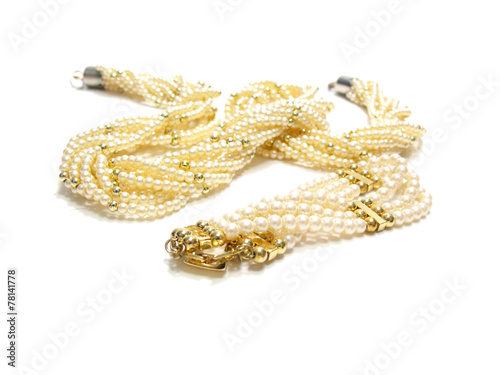twisted strands of white pearls on a white background