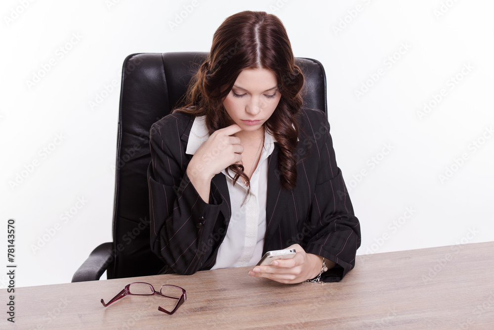 Elegant business woman with mobile phone in the office Elegant business woman with mobile phone in the office