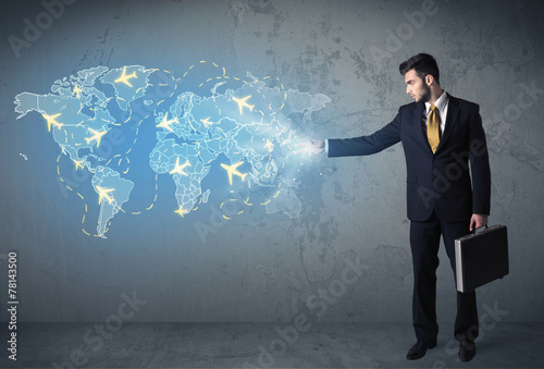 Business person showing digital map with planes around the world