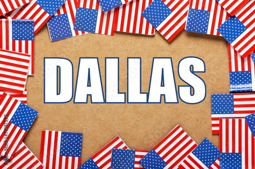 The title Dallas with a border of USA Flags