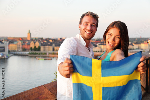 Swedish people showing Sweden flag in Stockholm © Maridav