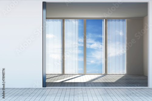 Modern Empty Room Interior with Large Windows and Clouds behind