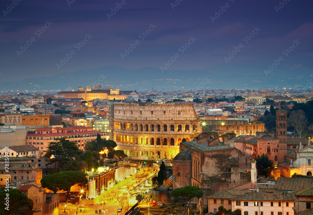Colosseum in Rome after sunse with citylights