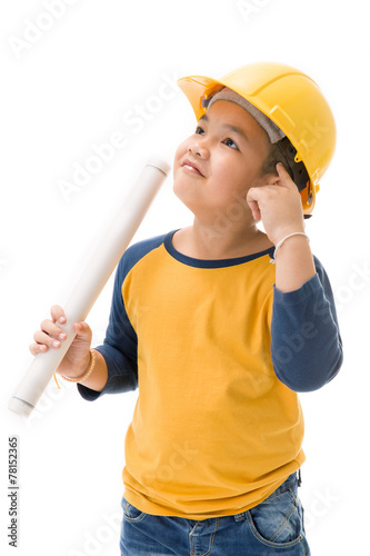 Young asian child construction Worker Holding equipment