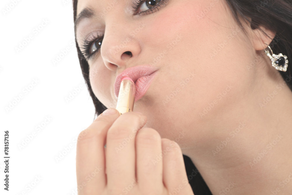A beautiful girl paints lips with lipstick. beauty woman. profes A beautiful girl paints lips with lipstick. beauty woman. profes