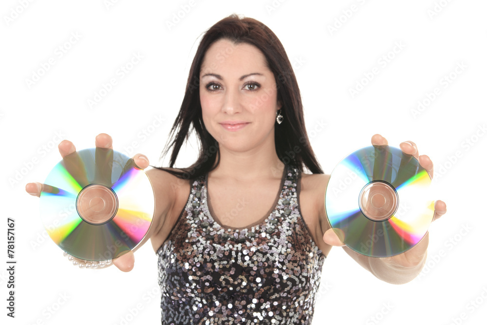 A young beautiful woman in silver dress posing at studio over wh A young beautiful woman in silver dress posing at studio over wh