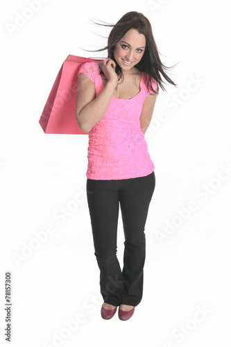 A young woman well dressed with bags on studio white background