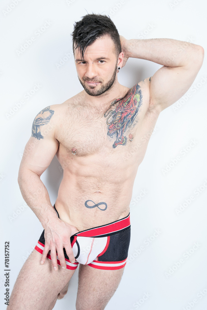 Fototapeta premium A Handsome men in underwear over a studio white background