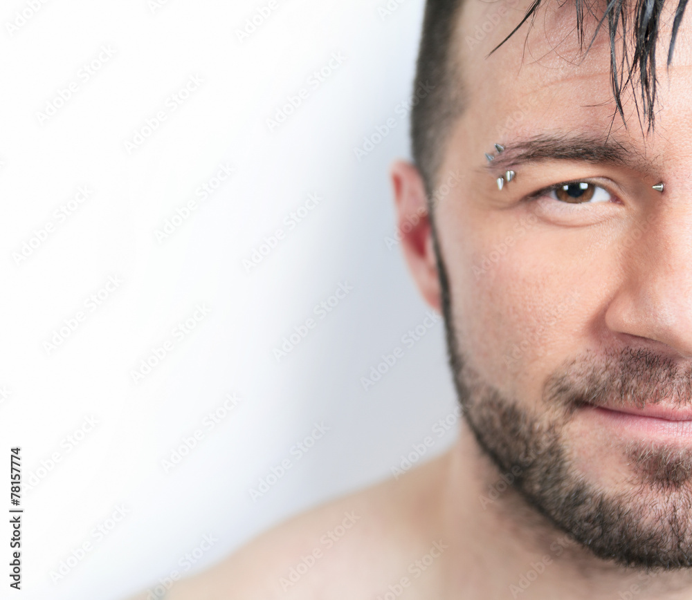 Fototapeta premium A sexy portrait of a man over a gray background