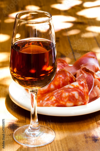 Glass of sherry with a snack (ham, jamon, parma).