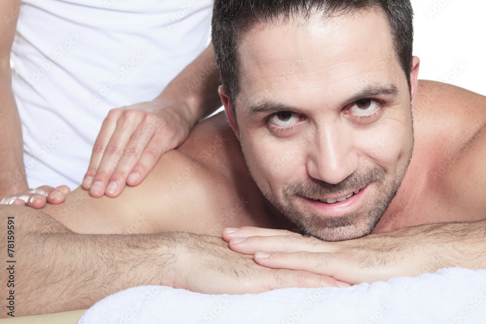 Obraz premium Man receiving Shiatsu massage from a professional masseur at spa