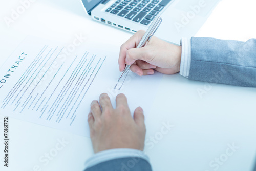 Business man signing a contract