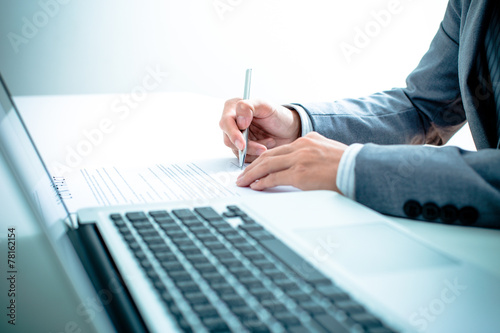 Business man signing a contract