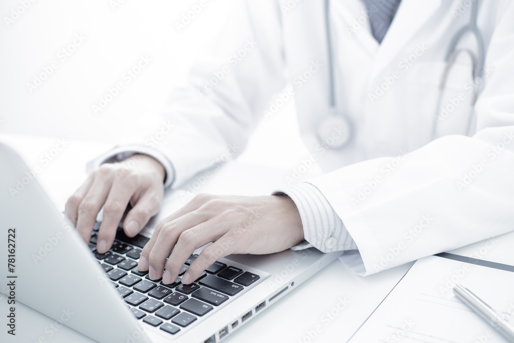 Close-up of a medical worker with laptop Close-up of a medical worker with laptop