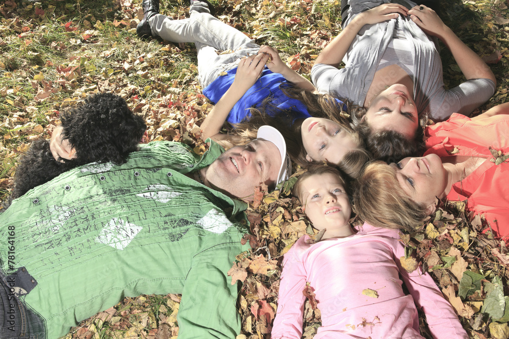 Fototapeta premium family throw autumnal leaves