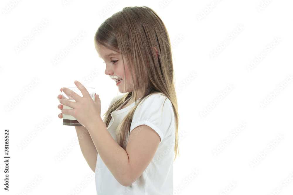 Little girl drinking milk on white background. Studio shot