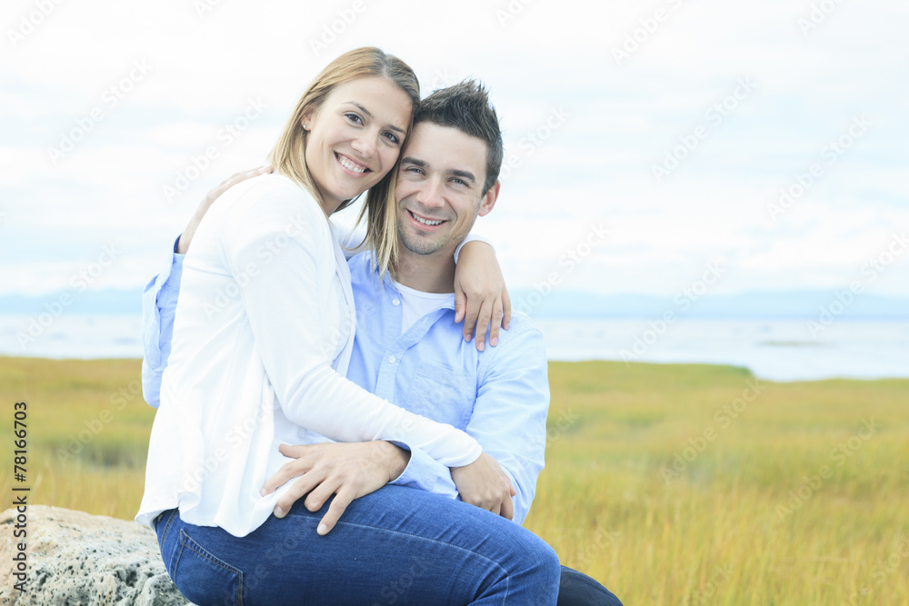 Young happy couple on summer season
